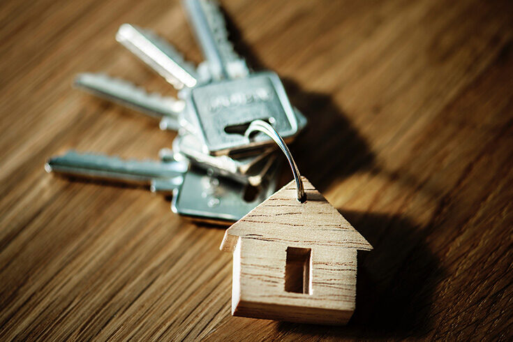 A bunch of keys with a house-shaped pendant