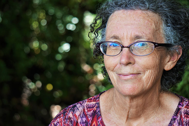 Elderly woman wearing glasses