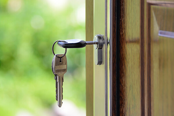 keys-in-door-lock Key hanging in a door lock