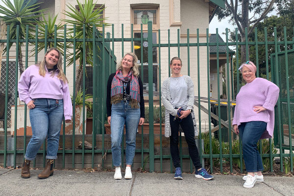 womens-services-team-memberes Women's Services staff standing in front of Sacred Heart Mission's Women's House