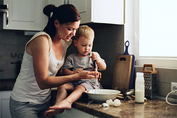 mother-son-cooking A mother and her toddler cook together in the kitchen