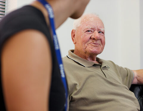 Elderly man talking to a Social Worker