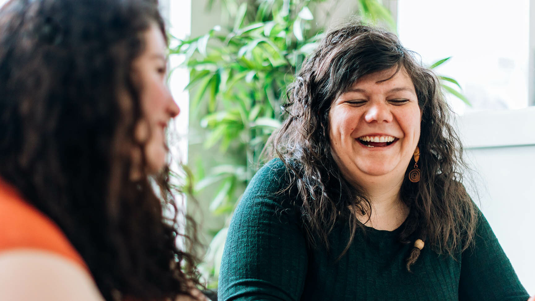 Two women talking and laughing