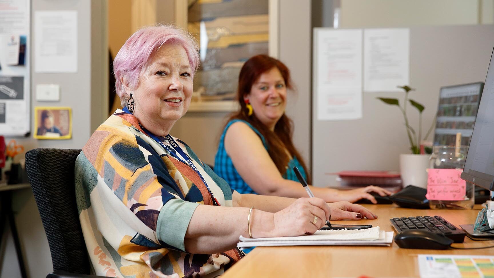 Women's House team working in their office