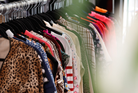 rack of feminine tops of all different colours with a leopard print t-shirt at the front