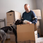 Man moves into a new home with his dog