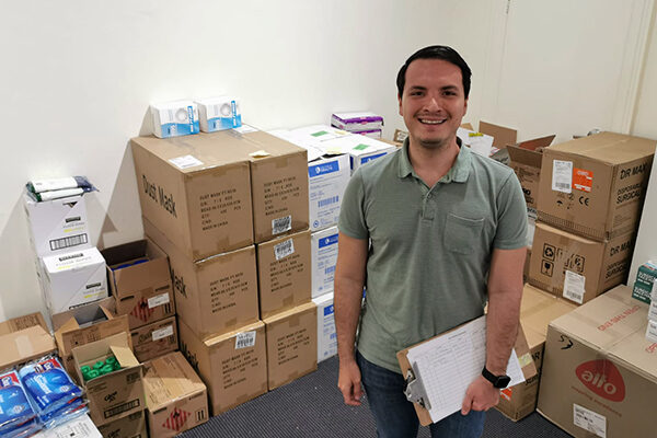 Sacred Heart Mission team member Felipe working at SHM's PPE store