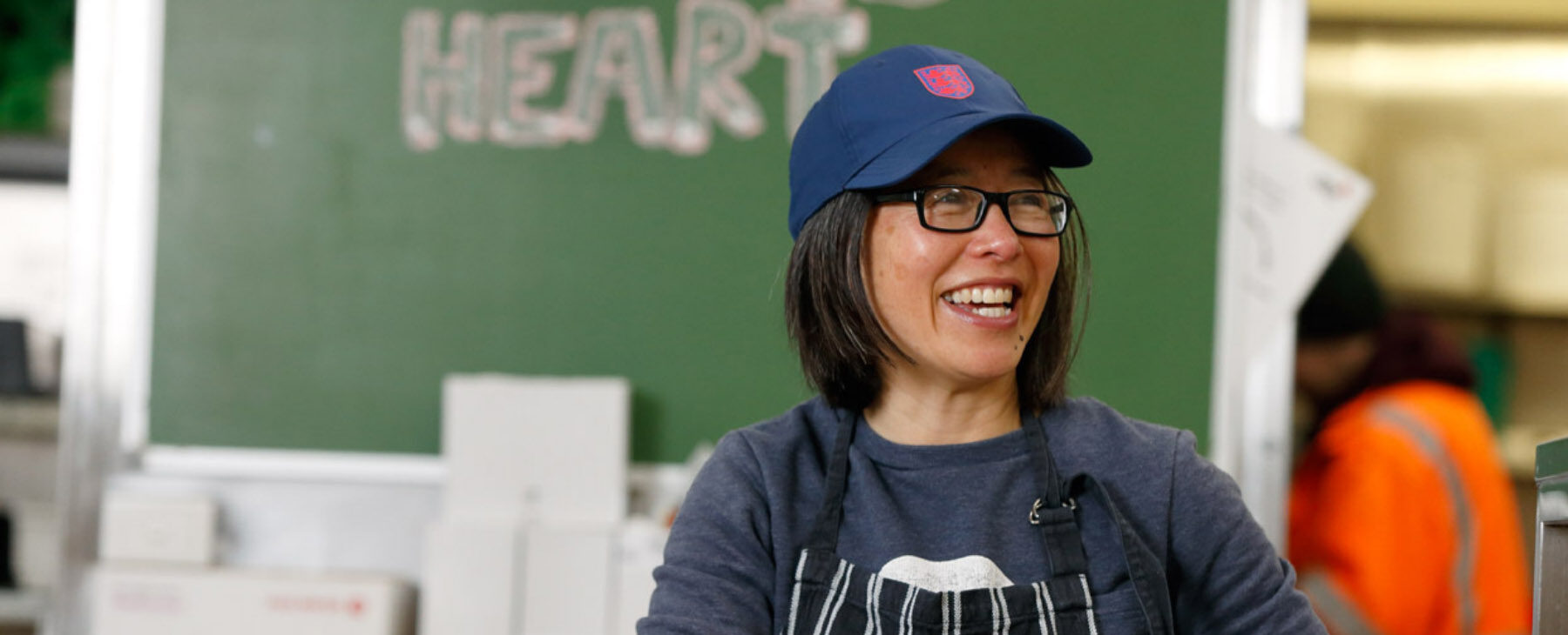A dining hall volunteer in the kitchen