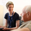 A staff member speaks to a client