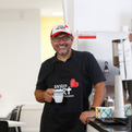 Volunteer holding a cup of coffee