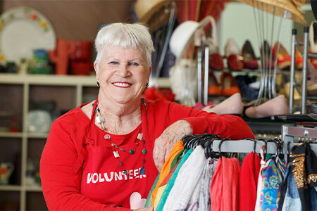 Smiling op shop volunteer