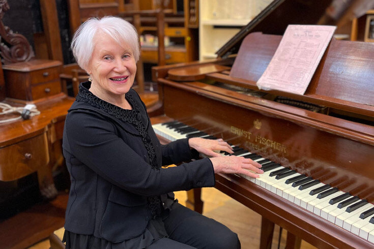 trish-williams-op-shop-coordinator Trish Williams, op shop coordinator, playing the piano
