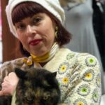 Tracey in the op shop with a furry friends