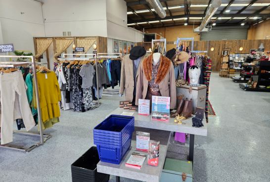 Racks of clothing inside the open plan of sacred heart mission coburg op shop