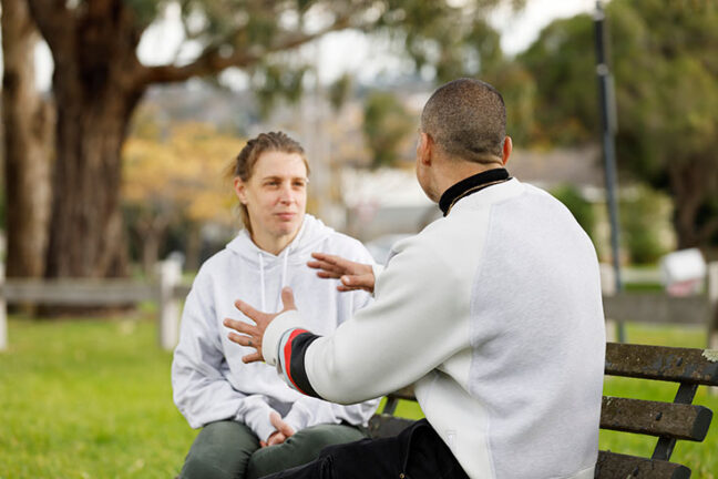 Tyson talks with case manager Tania