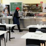 Volunteers work in the Dining Hall