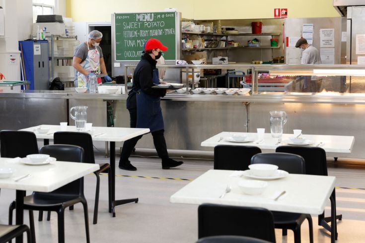 Volunteers work in the Dining Hall