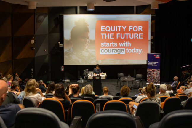Hang Vo delivering an oration at the launch of the RMIT Social Equity Research Centre. On a slide behind her, the words 
