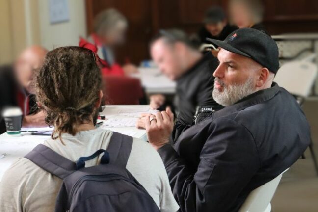 Michael talks with a client