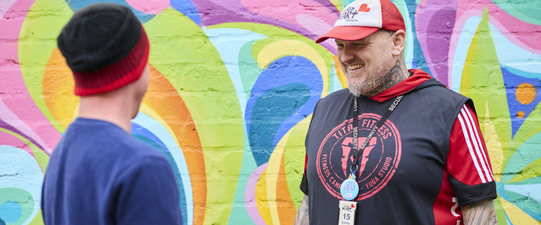 Staff member with participant at Central