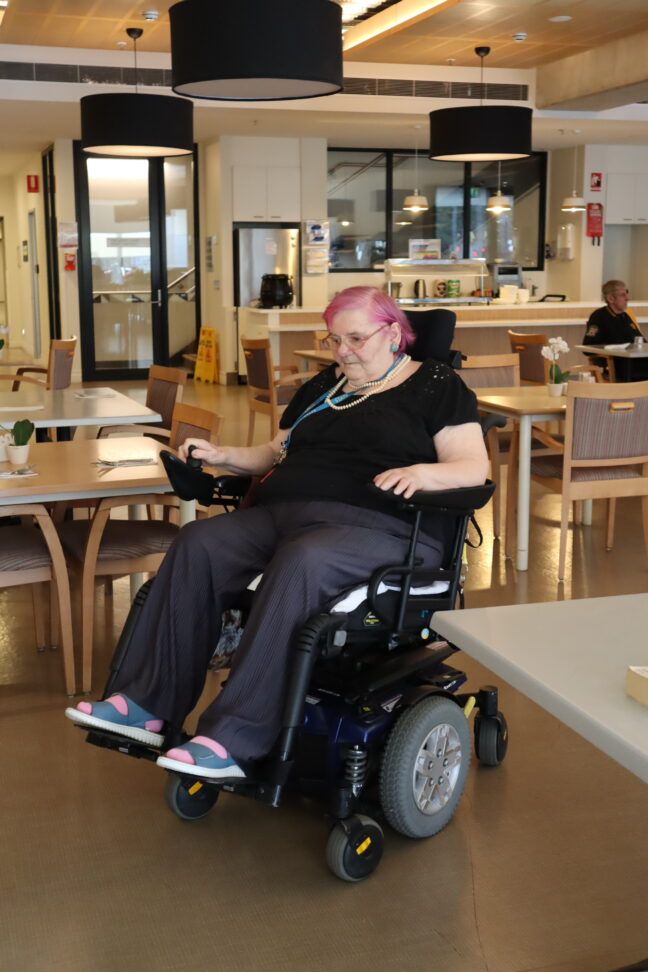 Daphne using her motorised wheelchair